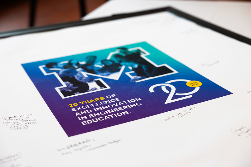 A signature poster with a graphic that says "20 years of excellence and innovation in engineering education."